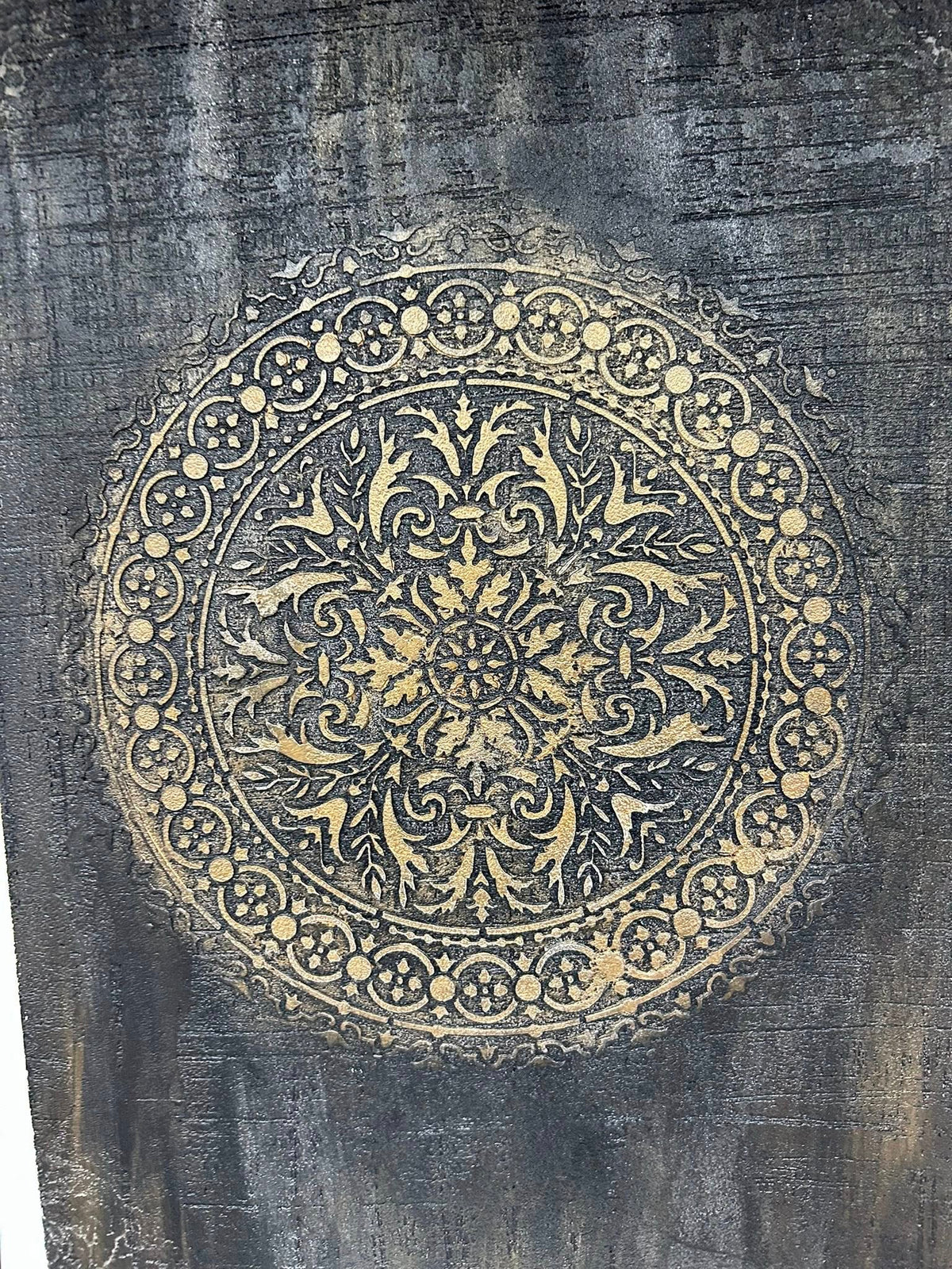 accent wall design in black marmorino plaster and bronze stencil