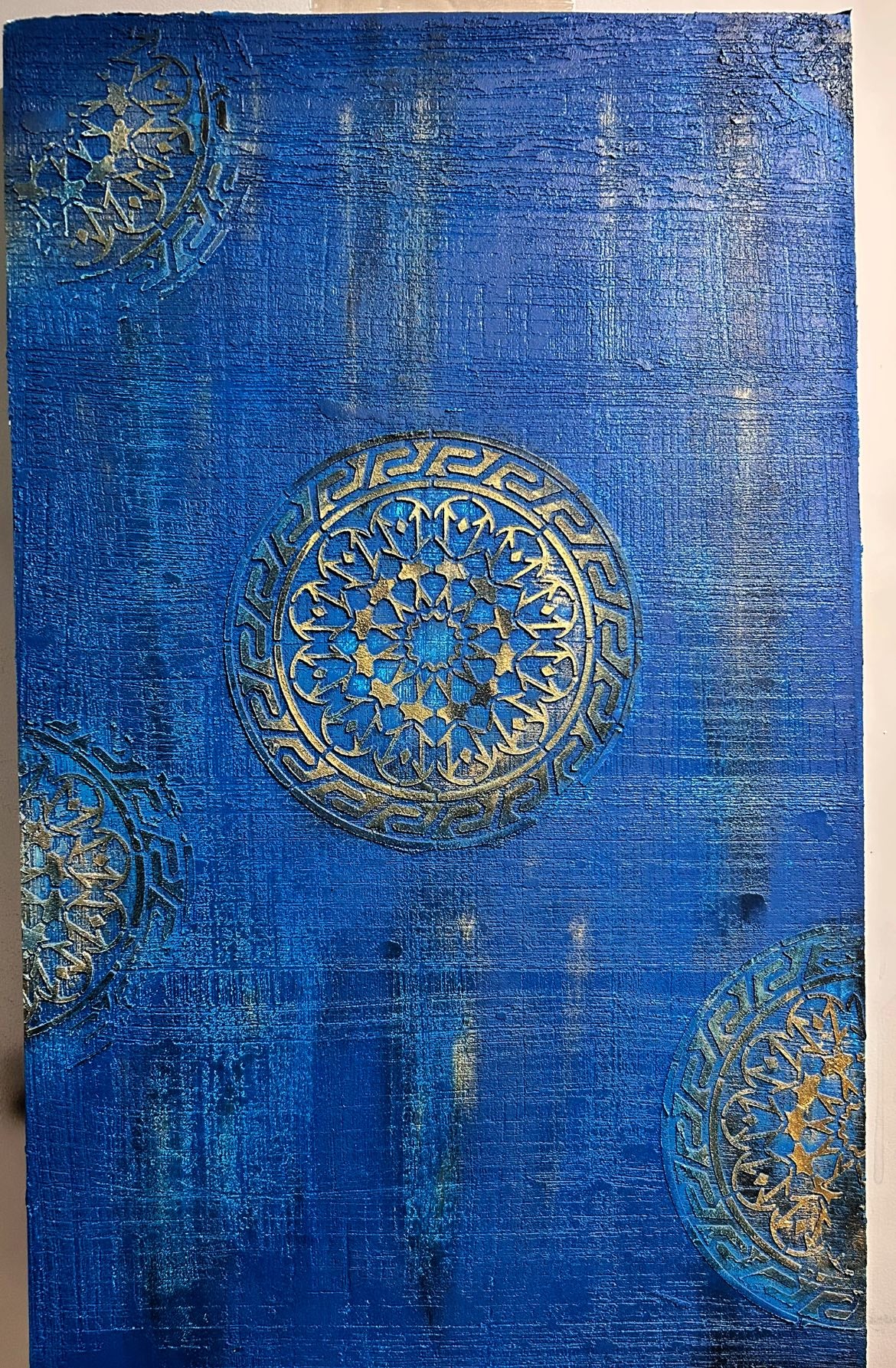 accent wall in royal blue and gold stencils