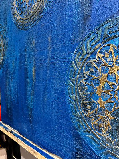 accent wall in royal blue and gold stencils